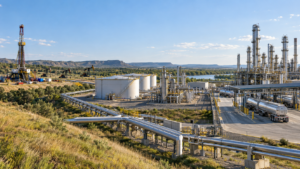 Oil and gas value chain showing upstream production, midstream pipelines and storage, and downstream refining and distribution.